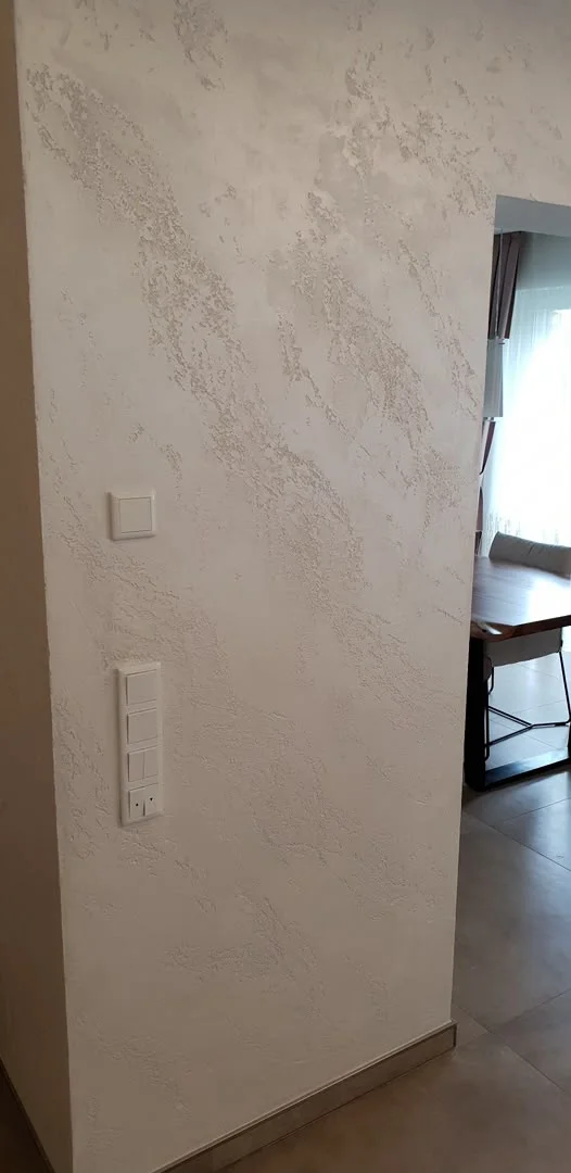 Light wall surface beside a doorway
